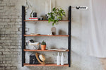 Libreria da parete realizzata con struttura in metallo e ripiani in legno massello nobile