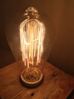 Chestnut wood table lamp with vintage finishes.