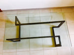 Design table made of wrought iron and glass