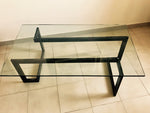 Design table made of wrought iron and glass