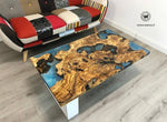 Coffee Table di design realizzato con radice di ulivo secolare immerso in resina effetto acqua marina su struttura in metallo bianco opaco