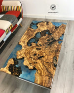Coffee Table di design realizzato con radice di ulivo secolare immerso in resina effetto acqua marina su struttura in metallo bianco opaco