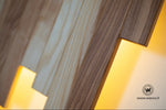Applique di design realizzata in legno massello nobile con led integrato
