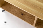 TV stand in solid oak on a matt black metal structure