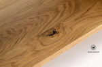 TV stand in solid oak on a matt black metal structure