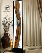 Piantana di design realizzata in legno massello di ulivo secolare immerso in mare di resina effetto acqua marina