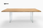 Design table made of solid oak wood on acrylic crystal