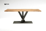 Design table made of solid oak wood on a metal structure