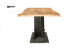 Design table made of solid oak wood on a metal structure