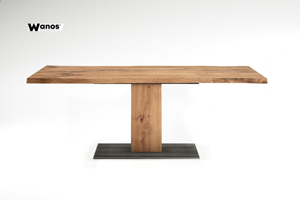 Design table made of solid oak wood on a central metal structure in wood  and metal