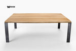 Design table made of solid oak wood on a space-saving metal structure