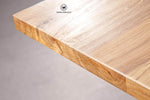Design table made of solid oak wood on a metal structure
