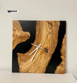 Design wall clock made of solid chestnut wood immersed in marbled blue resin