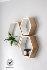 Design geometric hexagonal wall shelf made of solid wood.