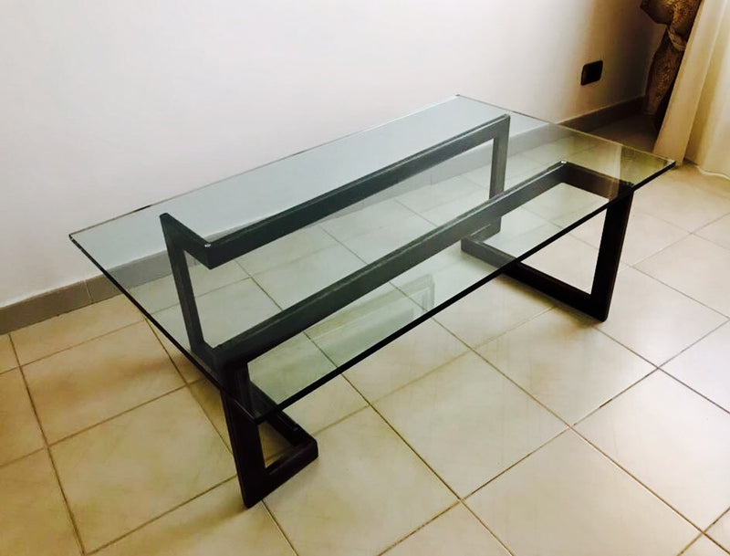 Design table made of wrought iron and glass