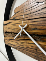 Wall clock in solid aged chestnut wood with matt black metal structure
