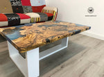 Coffee Table di design realizzato con radice di ulivo secolare immerso in resina effetto acqua marina su struttura in metallo bianco opaco