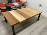 Design Coffee Table with solid wood top with seven different essences on a geometric structure in matt black metal