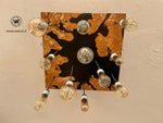 Lampadario di design con 11 punti luce in legno massello di ulivo e resina di colore nero