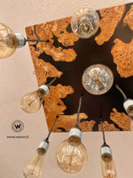 Design chandelier with 11 light points in solid olive wood and black resin