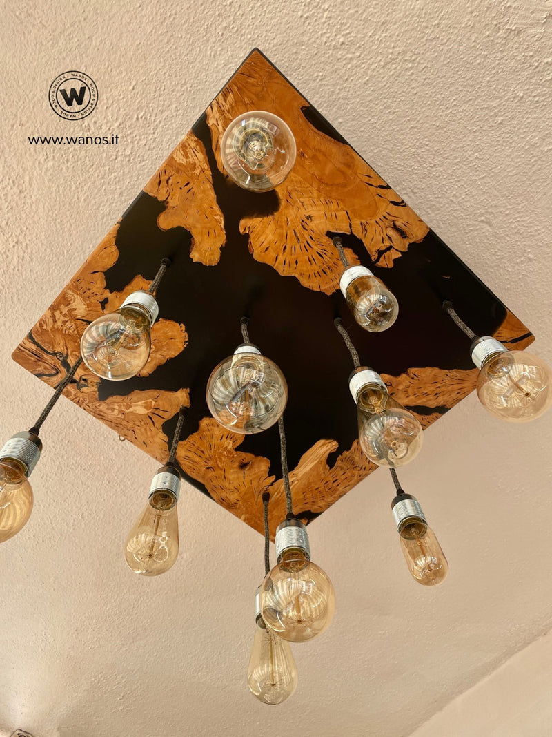 Lampadario di design con 11 punti luce in legno massello di ulivo e resina di colore nero