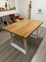 Design table made of solid oak wood on a matt white metal structure