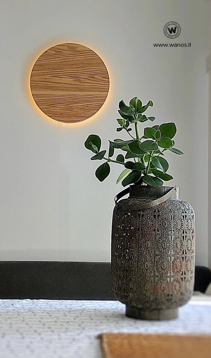 Circular wall light made of solid chestnut wood with integrated LED light