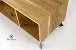 TV stand in solid oak on a matt black metal structure