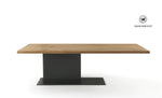 Design table made of solid chestnut wood on a matt black handcrafted iron structure