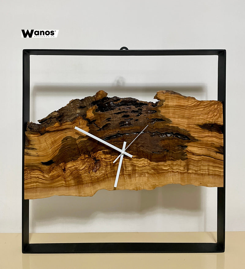 Design wall clock made of solid centuries-old olive wood on a metal structure.