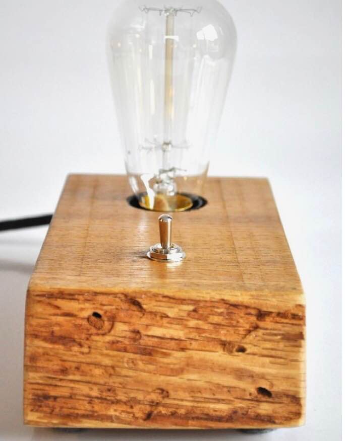 Chestnut wood table lamp with vintage finishes.