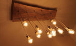 Lampadario in legno di castagno massello con dodici punti luce