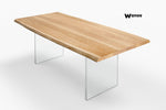 Design table made of solid oak wood on acrylic crystal