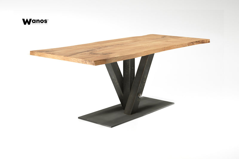 Design table made of solid oak wood on a metal structure