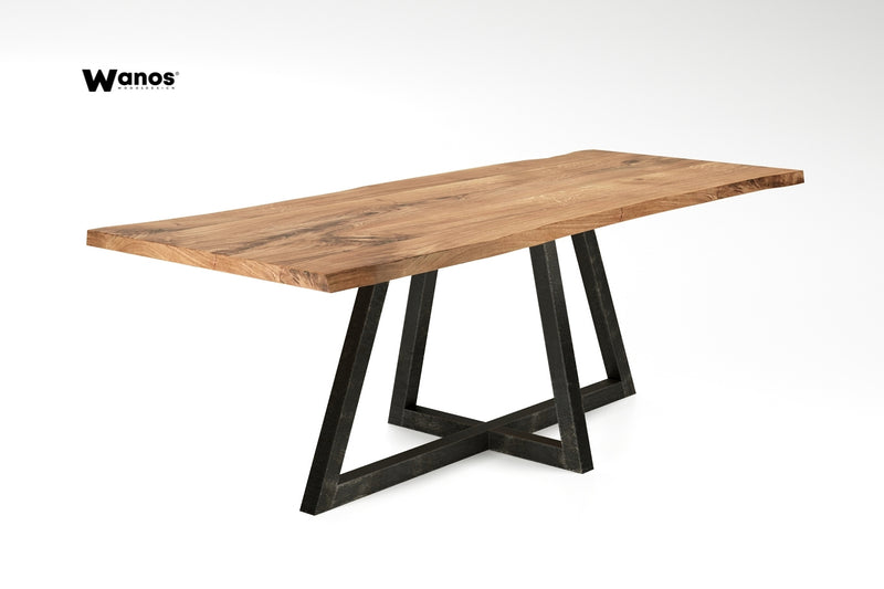 Design table made of solid oak wood on a geometric metal structure