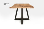 Design table made of solid oak wood on a geometric metal structure