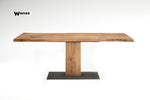Design table made of solid oak wood on a central metal structure in wood and metal