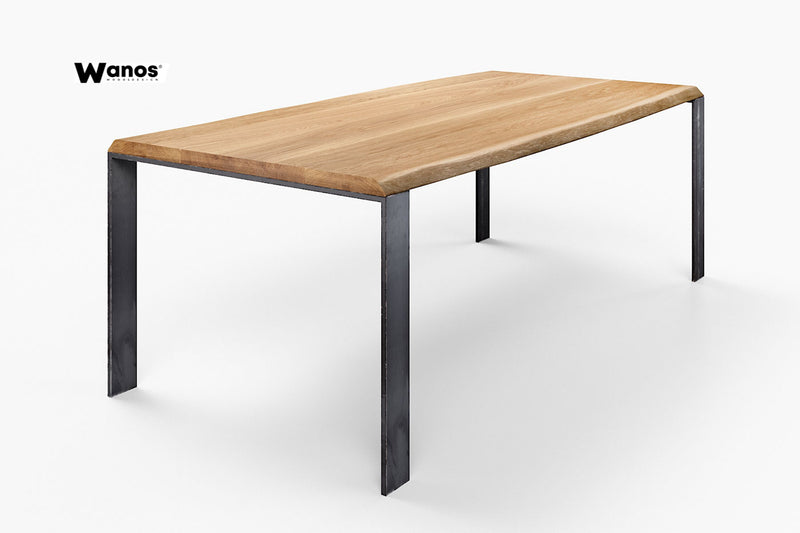 Design table made of solid oak wood on a space-saving metal structure