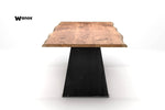 Design table made of solid chestnut wood on a handcrafted metal structure