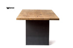 Design table made of solid oak wood on a metal structure