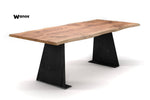 Design table made of solid chestnut wood on a handcrafted metal structure