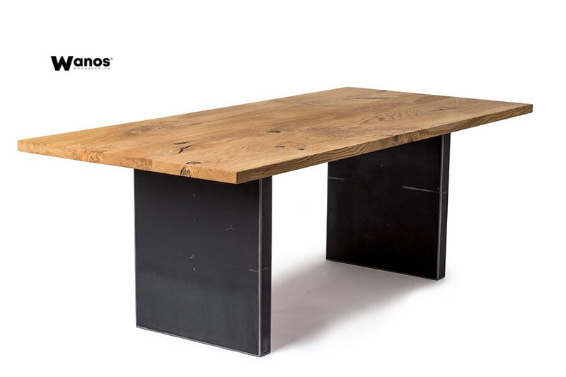Design table made of solid oak wood on a metal structure