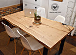 Design table in aged debarked solid chestnut wood on a metal structure